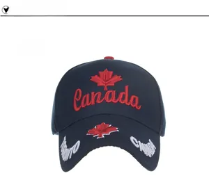 Close-up of navy baseball cap featuring red Canada embroidery and maple leaf details