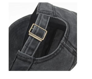 Macro shot of adjustable metal buckle on washed cotton flat top military cap back