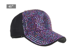 Detail view of iridescent purple rhinestones on a black baseball cap at 45 degree angle