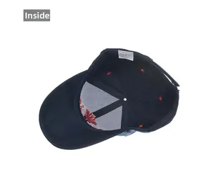 Detailed inside view of navy baseball cap showing red maple leaf embroidery and washing label