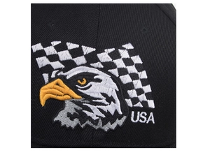 Close-up of eagle embroidery with checkered flag and USA text on a black baseball cap