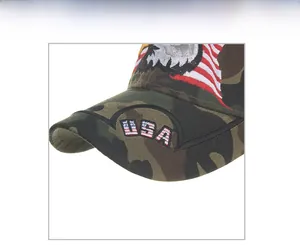 Detailed close-up of eagle embroidery and USA flag texture on camouflage baseball cap