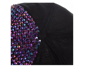Macro detail of black woven baseball cap with iridescent purple rhinestones and top stitching