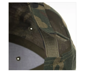 Close-up of the adjustable hook-and-loop strap on the camouflage baseball cap