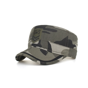 Detail of army green camouflage flat top military cap with US embroidery patch
