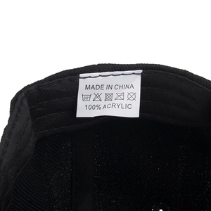 Black baseball cap with eagle embroidery and inner care label made of 100% acrylic