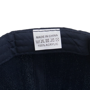 Detail of navy baseball cap interior with 100% acrylic care label and high-quality stitching