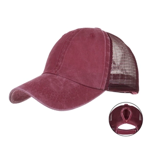 Detail of burgundy ponytail baseball cap with breathable mesh and ponytail hole back