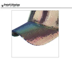 Close-up of sparkling purple gradient sequins on the brim and crown of the baseball cap