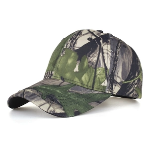 Close-up detail of camouflage leaf print and stitching on the baseball cap