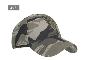 Detail view of camouflage baseball cap with embroidered star shield patch at 45 degree angle