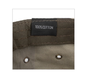 Detail of military cap interior showing 100% cotton label and breathable eyelets