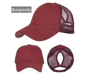 Detail view of wine red ponytail baseball cap with breathable mesh and back opening