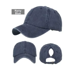 Detail view of Navy Blue washed cotton baseball cap featuring unique crisscross ponytail hole