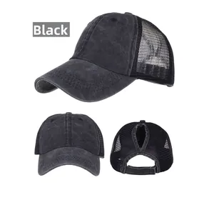 Detail showing the ponytail hole design and mesh back on the black washed cotton cap