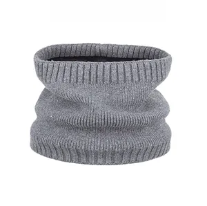 Detail of grey ribbed knit neck warmer showing vertical striped texture and warm winter fabric