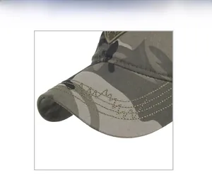 Detailed close-up showing camo pattern fabric and reinforced stitching on baseball cap brim
