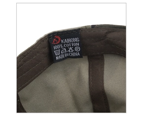 Detail view of cotton inner lining and washing label of the camouflage baseball cap