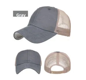 Detail view showing grey cotton fabric and beige mesh back of the trucker cap