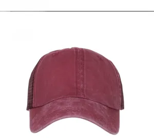 Front view of washed burgundy ponytail baseball cap with breathable mesh back and solid panel