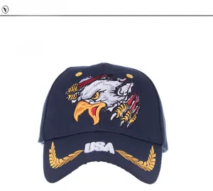 Detailed embroidery of a golden eagle head and white USA text on a navy baseball cap