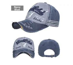 Detail of navy blue washed cotton baseball cap with Black Rebel embroidery and bronze buckle