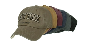 Detail view of washed cotton baseball caps in six colors with New York embroidery