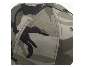 Macro view of camouflage baseball cap showing canvas texture and embroidered eyelet detail