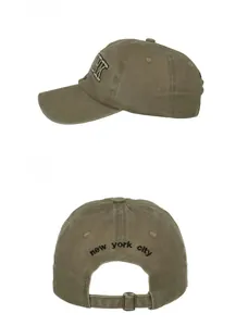 Detail view showing New York embroidery on side and back metal buckle adjustment of cap