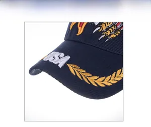 Detailed macro view of 3D USA embroidery and golden wheat stalks on navy baseball cap