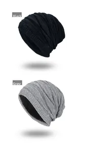 Detail view of winter knitted beanies in black and gray with warm fleece lining and wave texture