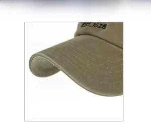 Close-up of khaki washed cotton baseball cap with detailed EST. 1625 embroidery