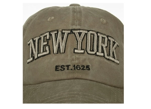 Close-up of khaki baseball cap featuring NEW YORK embroidery and EST.1625 detail