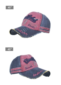 Detail of vintage washed cotton baseball cap with Black Rebel embroidery and frayed edges
