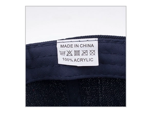 Detail view of the inner wash label showing 100% acrylic material and care instructions