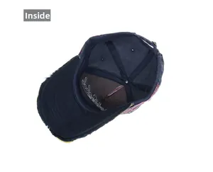 Detail view of washed cotton baseball cap with embroidery and distressed brim finish