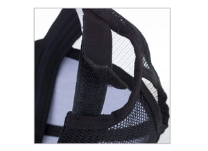 Detail view of the black mesh trucker hat showing the adjustable velcro back strap closure