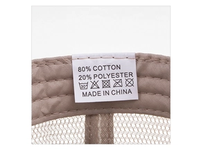 Detail view of the washed cotton baseball cap inner label showing 80% cotton material