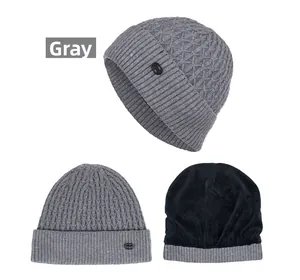 Detail view of gray knitted beanie with thermal fleece lining and Fashion emblem logo