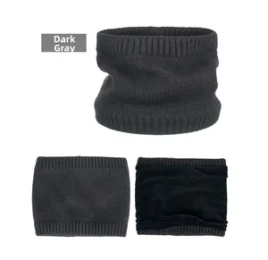Detailed view of dark grey knitted neck gaiter showing soft fleece lining and texture