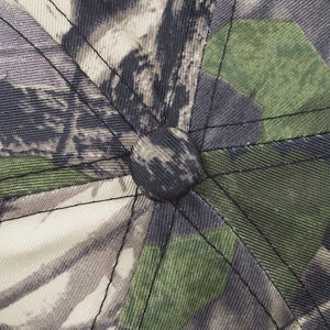 Overhead view of camouflage baseball cap crown with durable twill fabric and fine stitching