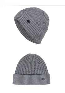 Macro detail of grey knit beanies featuring diamond pattern texture and fashion label