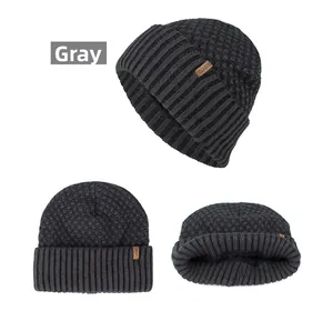 Detailed views of dark grey knit beanie featuring waffle texture and classic leather patch