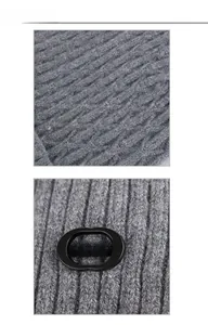 Detail view of the dark grey knitted beanie with vertical stripes and fashion label