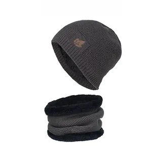 Detail of dark grey knitted hat and neck gaiter set with thick black fleece lining