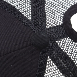 Internal view of black ponytail baseball cap showing breathable mesh and stitching detail
