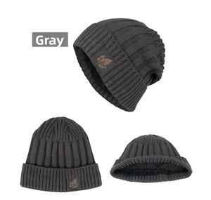 Detailed view of gray knit beanie with warm fleece lining and maple leaf leather patch