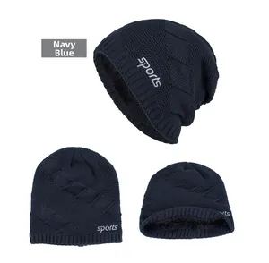 Detail of navy blue knit beanie showing the warm fleece lining and sports lettering