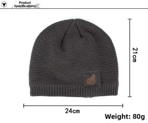 Detailed view of dark coffee knitted beanie with leaf embossed leather patch and size markings