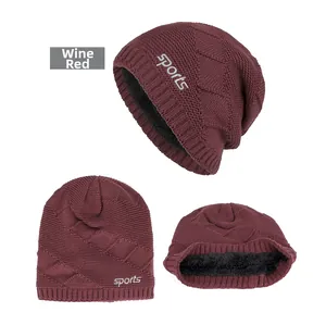Macro shot of wine red knitted sports beanie with warm fleece lining and diamond pattern